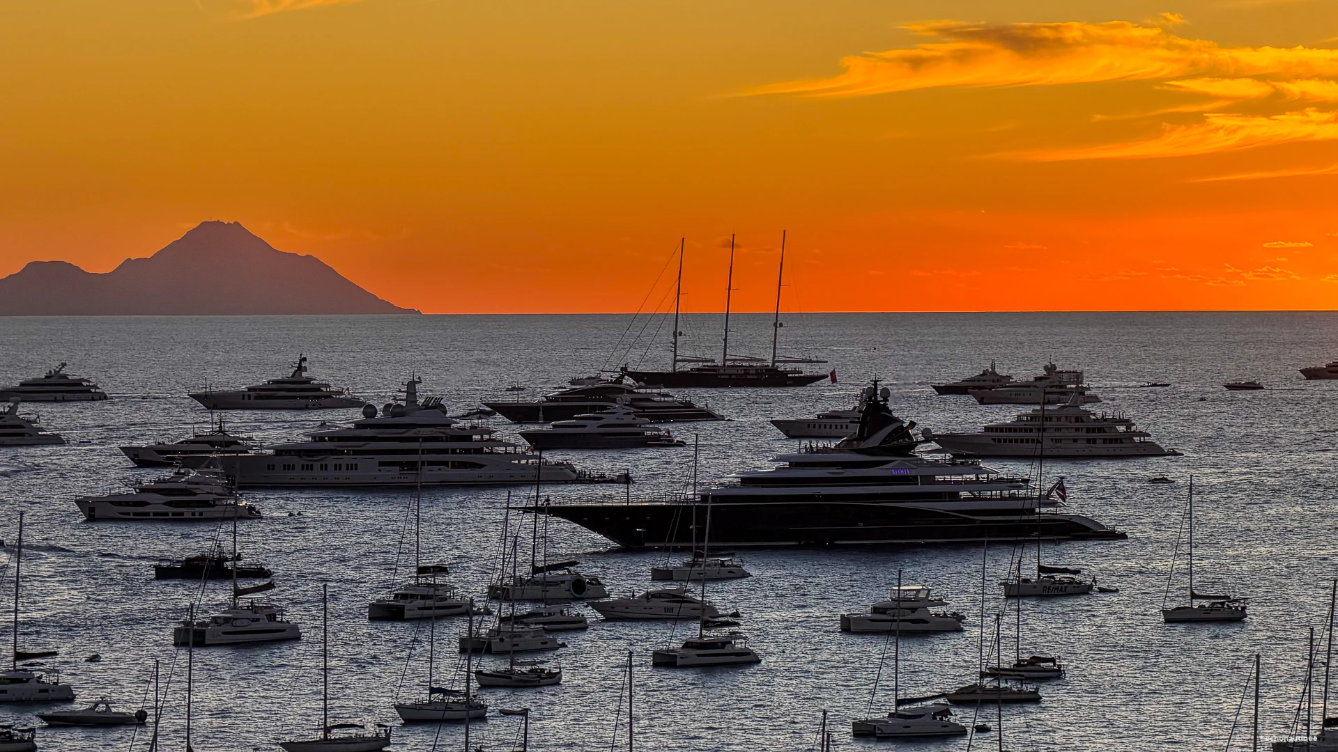 Sunset over Gustavia harbor with yacht